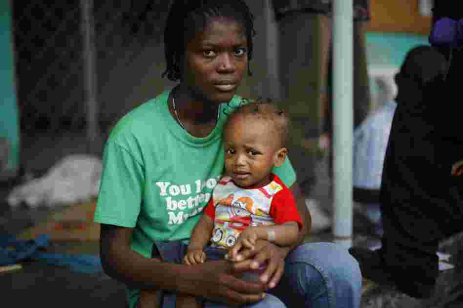 Rebecca Pierre holds sick baby Judson Abela.