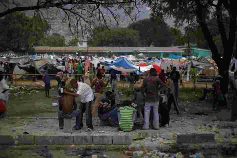 A tent city has sprung up on the soccer field next to the field hospital.