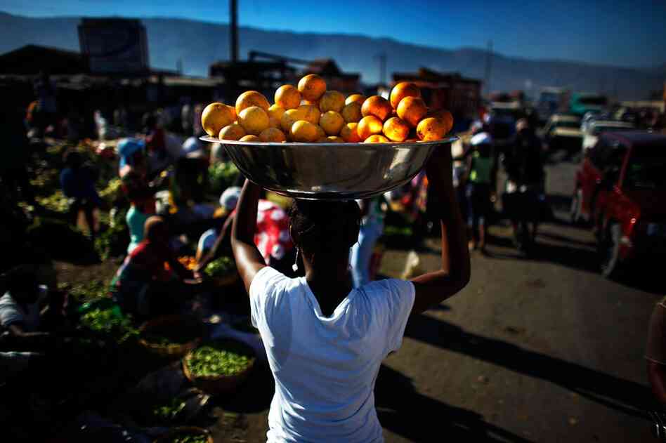 The main produce market in Port-au-Prince is open Thursday, but sellers say people aren't buying because they don't have money and the banks are closed.