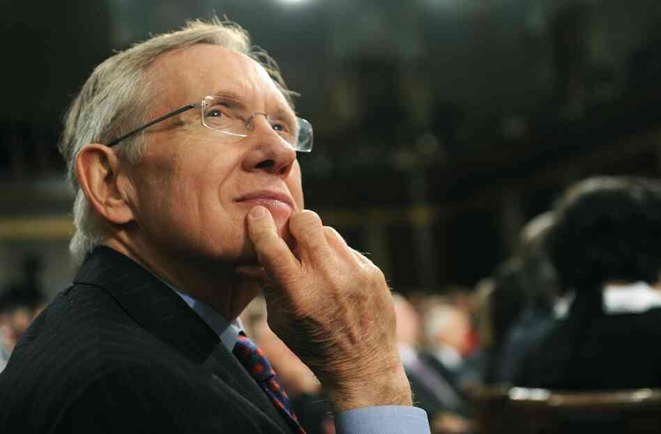 Senate Majority Leader Harry Reid listens to Obama. 