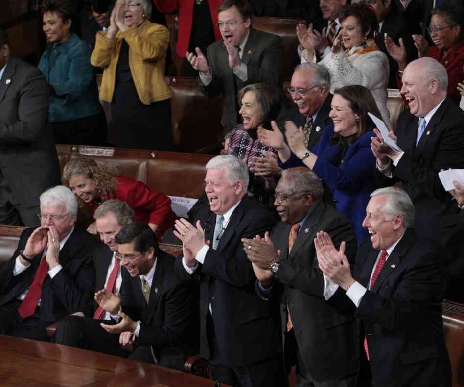 Democrats (from right) House Majority Leader Steny Hoyer of Maryland, House Majority Whip James Clyburn of South Carolina, and Connecticut Rep. John Larson applaud. 
