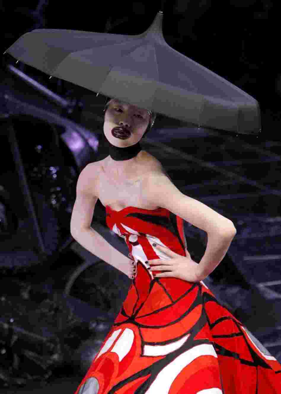 McQueen was known by some in the design industry as the  "enfant terrible" or "anarchist designer." A model wears one of McQueen's creations as part of his fall/winter 2009-10 ready-to-wear collection in Paris in March 2009. 