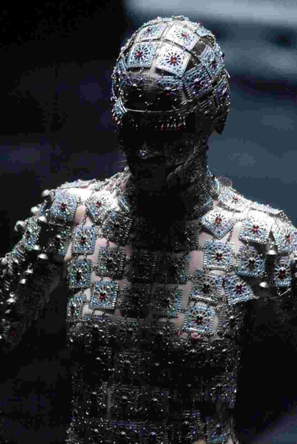 A model on the catwalk at McQueen's Black Fashion Show in March 2004. Though McQueen's designs were sometimes considered controversial and unconventional he was continually praised for his creativity. 
