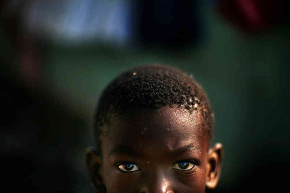 Alex remains with his mother as they attempt to survive amid the earthquake's wreckage and, like other Haitians, take things one day at a time.