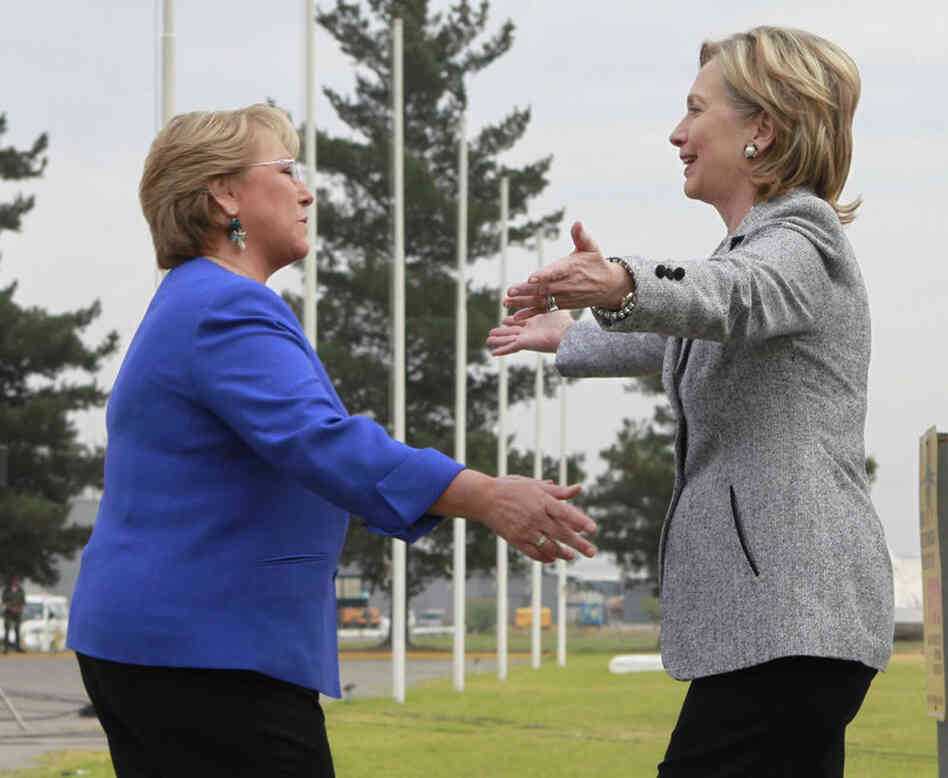 Secretary of State Hillary Clinton is greeted by Chilean President Michelle Bachelet at the airport in the capital, Santiago, on Tuesday. 