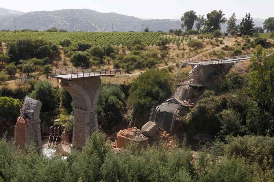Throughout central Chile, travelers faced obstacles. Here, a collapsed bridge across the Claro river, about 112 miles south of Santiago. 