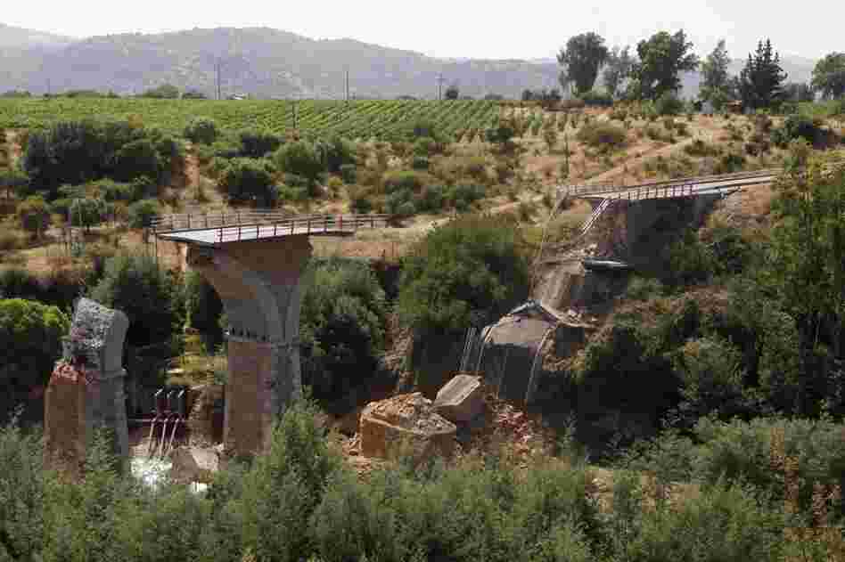Throughout central Chile, travelers faced obstacles. Here, a collapsed bridge across the Claro river, about 112 miles south of Santiago. 