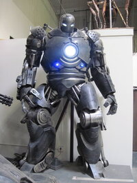 The Iron Monger's armor from <i>Iron Man</i> stands menacingly in the Legacy warehouse.
