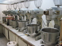 Seven mixers sit at the ready in a climate-controlled room. They are used for mixing foam — the first stage for making glue-on prosthetic devices.