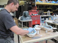 The mixed foam is then set in molds, baked and peeled out. Here, a technician constructs facial parts for the upcoming film <i>Thor</i>.