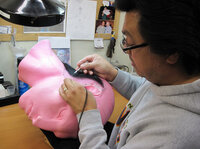 Michael Ornelaz, a wig maker at Legacy, fastens the hair to a superfine lace net — one strand at a time.
