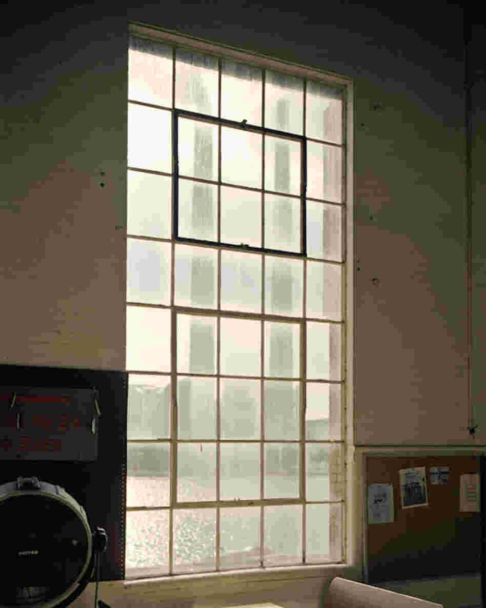 The Ohio River and the Mountaineer Power Plant are seen through a window in the Old Lock 24 Campgrounds Convenience Store in Racine.
