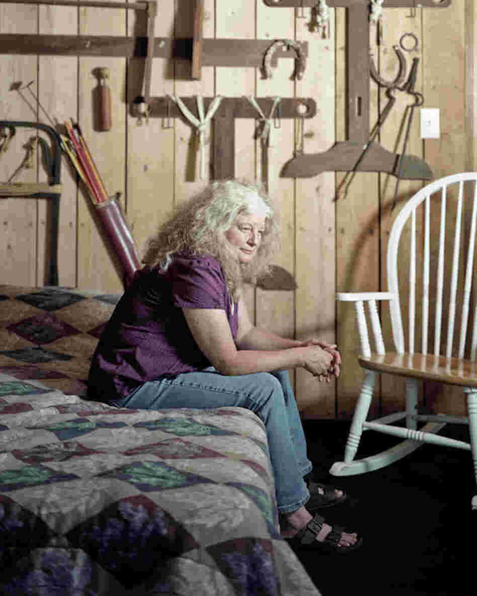 Cindy Parker, a resident of Rutland, Ohio, in Meigs County, sits in a cabin that houses her father's tools.