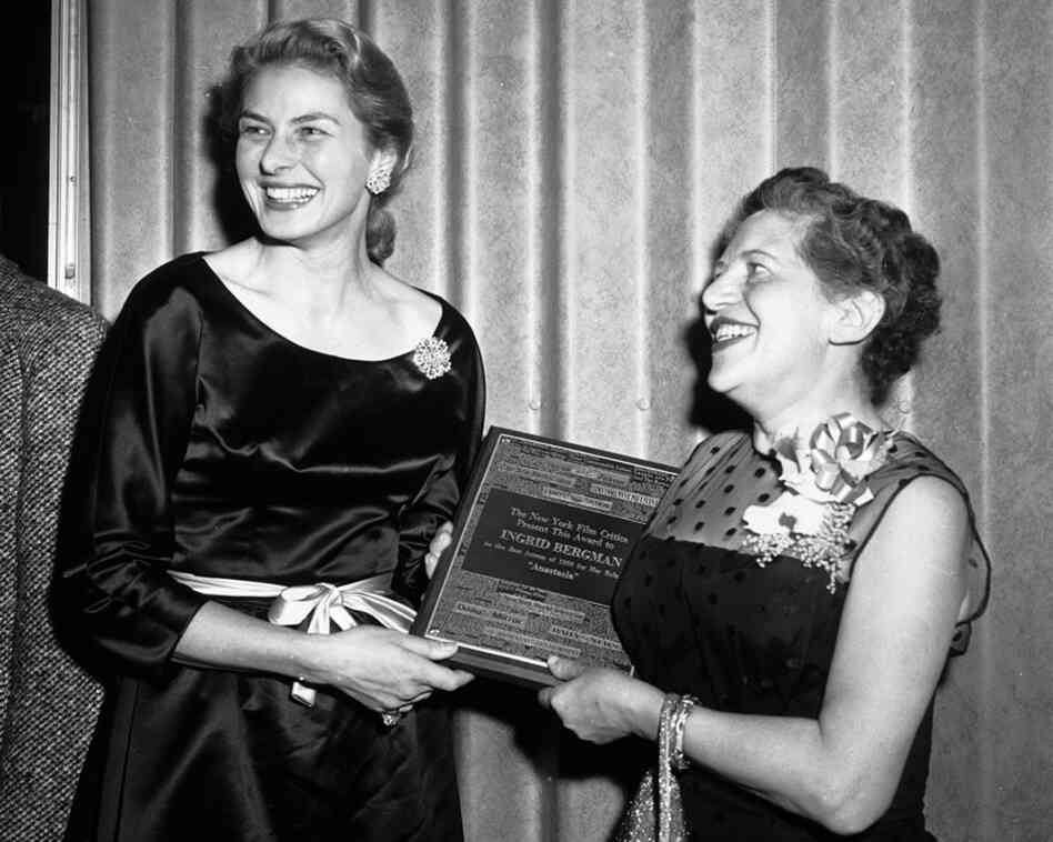 Swedish actress Ingrid Bergman (left) receives an award for best actress from Irene Thirer, chairman of the New York Film Critics, Jan. 19, 1957.