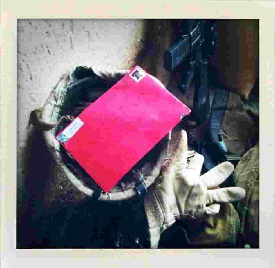A letter rests in the helmet of a U.S. Marine after he and his platoon members received mail from home in Marjah in Afghanistan's Helmand province.