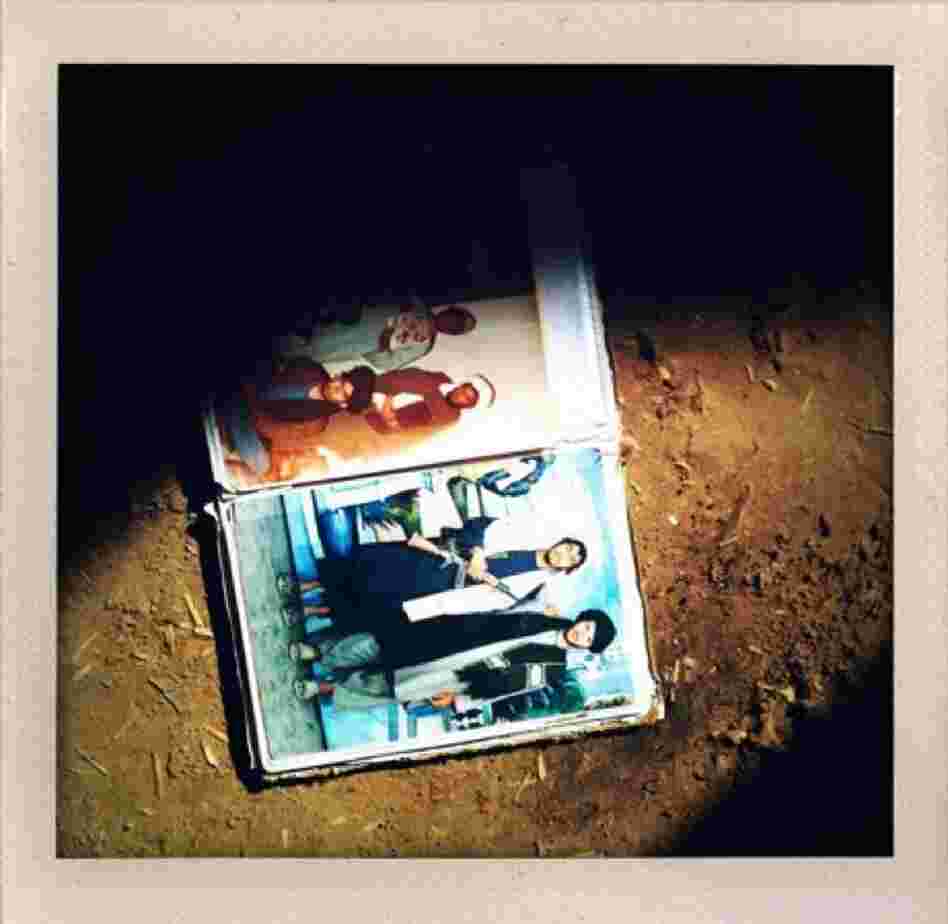 A book of photos of young men that U.S. Marines suspected of being Taliban members lies on the floor of a compound that the Marines searched in Marjah.