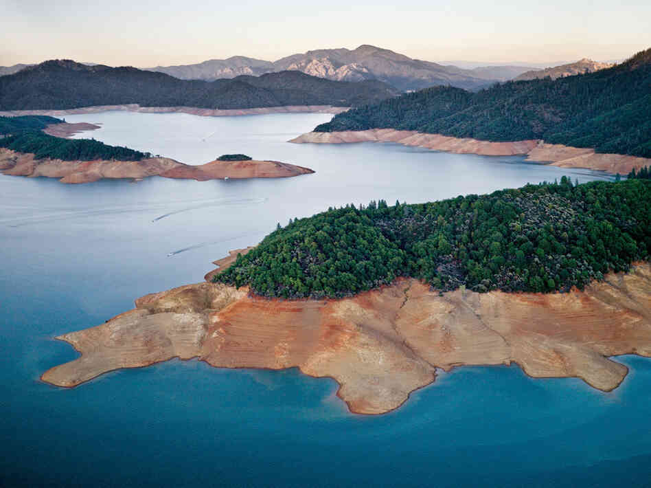 "A three-year drought has shrunk Shasta Lake to about 60 percent ofits long-term level, reducing water to cities and farms."