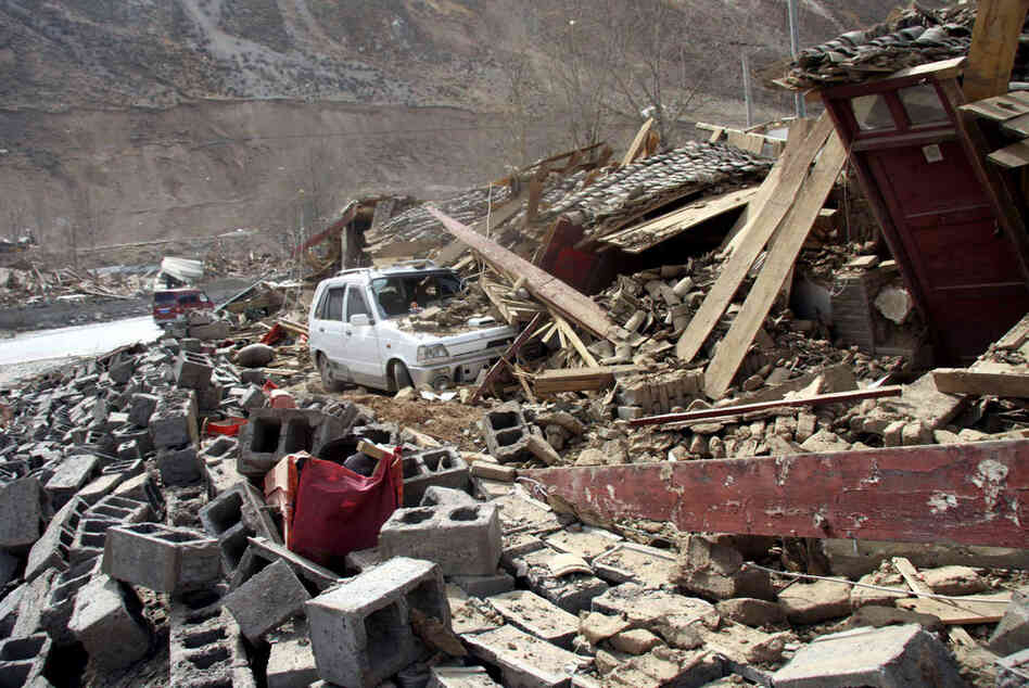 A car is buried under the rubble after an earthquake. Qinghai province averages more than five earthquakes a year of at least magnitude 5.0 according to Xinhua news agency. 