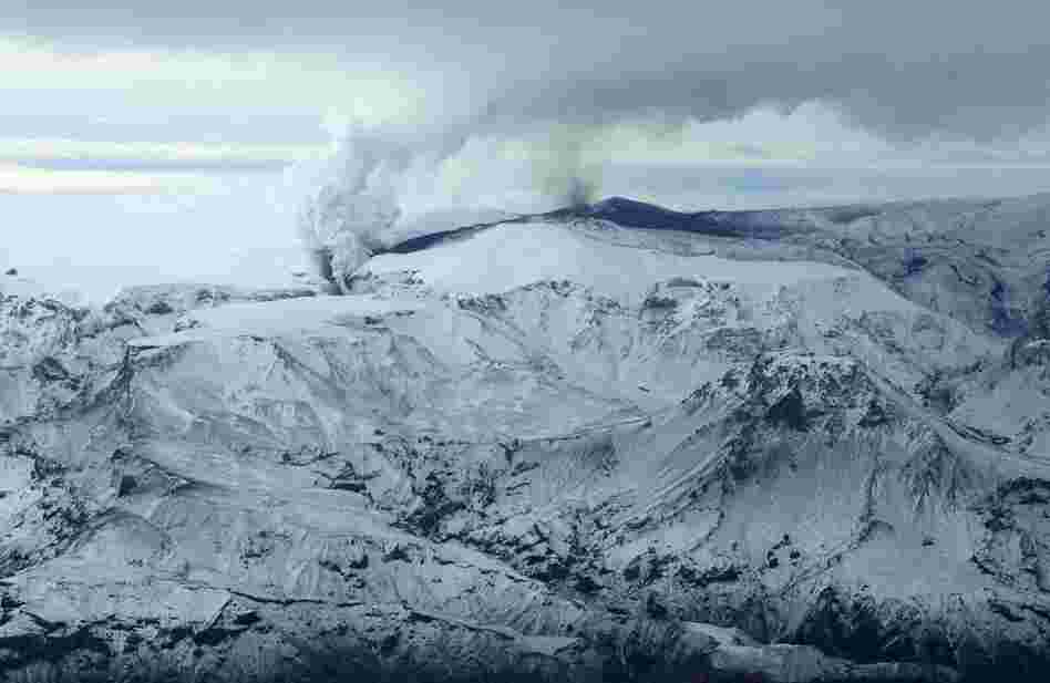 Smoke and ash spew out of a mountain volcano on March 21, 2010, in the region of the Eyjafjallajokull glacier in Iceland. 