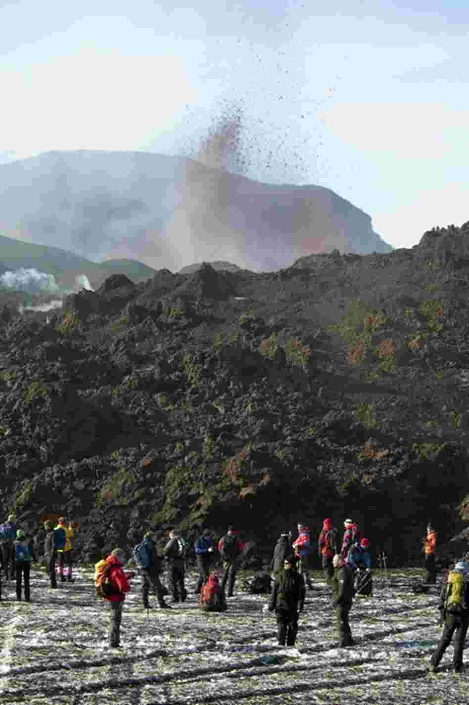 With lava still gushing, a small Icelandic volcano that initially sent hundreds fleeing from their homes has turned into a boon for the island nation's tourism industry, as visitors flock to catch a glimpse of the eruption. 
