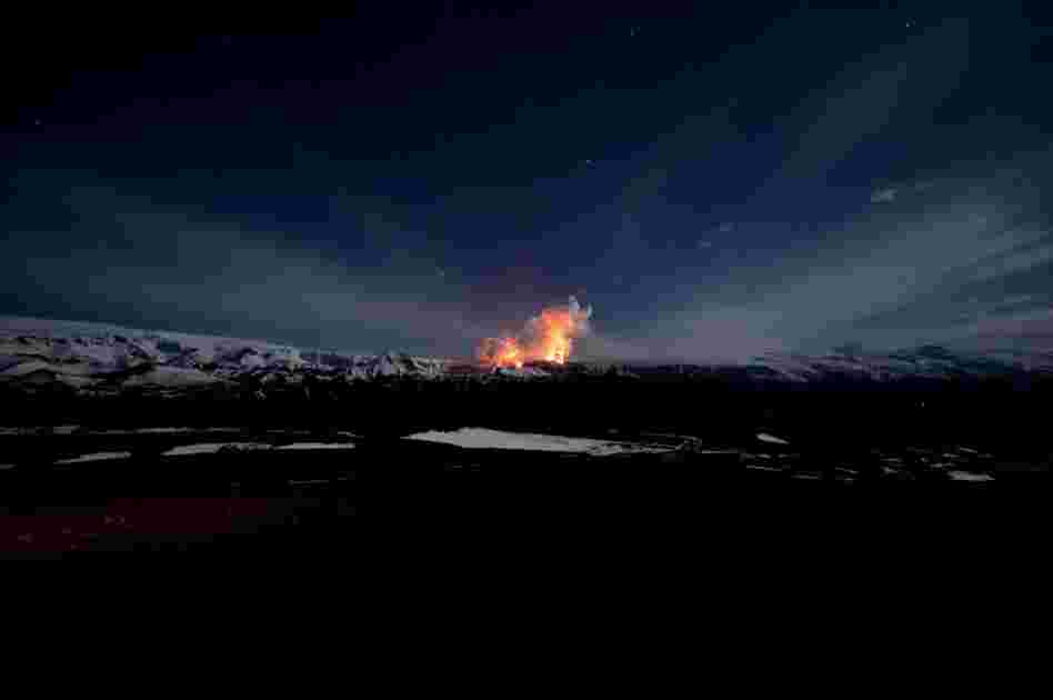 Lava lights up the night sky at the Fimmvorduhals volcano on March 27. 