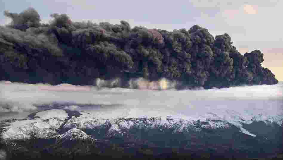 Smoke and steam hang over the volcano under the Eyjafjallajokull glacier on April 14. Volcanic ash drifting across the Atlantic forced the cancellation of flights in Britain and disrupted air traffic across northern Europe, stranding thousands of passengers. 