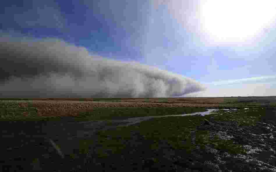 Smoke and ash from the Eyjafjallajokull volcano blow across a field April 19 near Nupur, Iceland. 