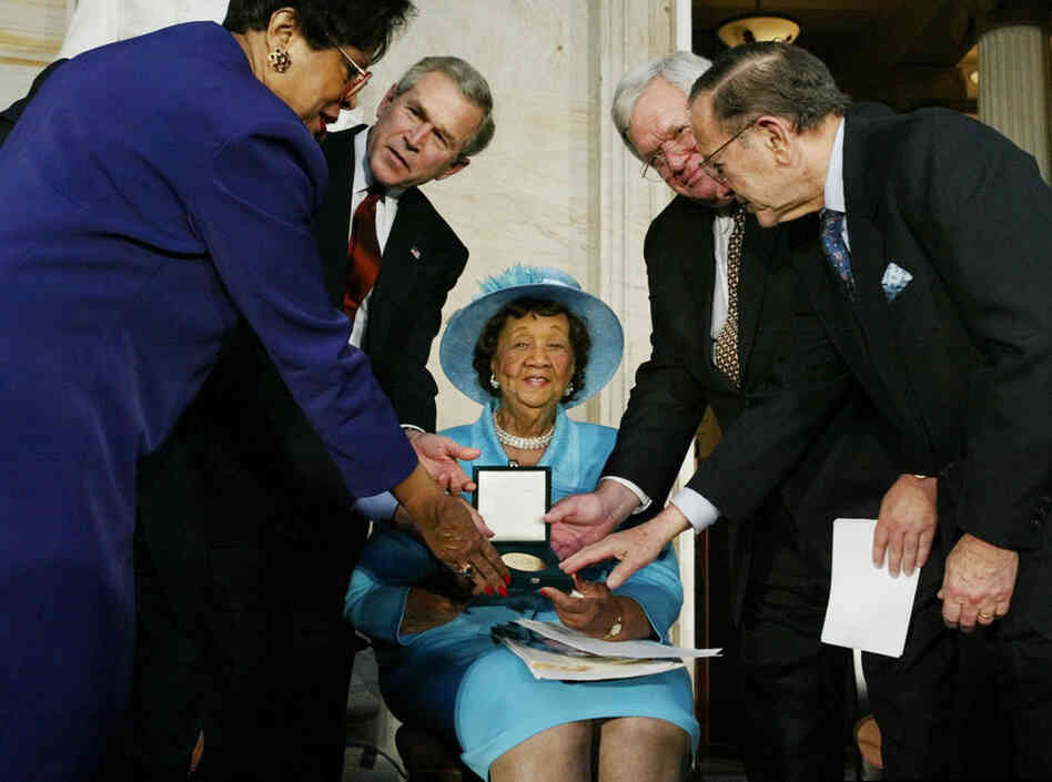 President Bush, second from left, presents the Congressional Gold Medal to Height on March 23, 2004. 