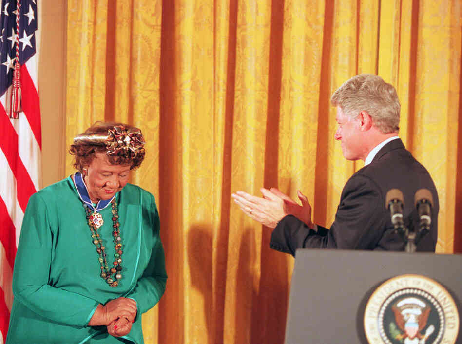 President Clinton applauds Height after presenting her with the Presidential Medal of Freedom during a ceremony in the White House East Room on Aug. 8, 1994. 