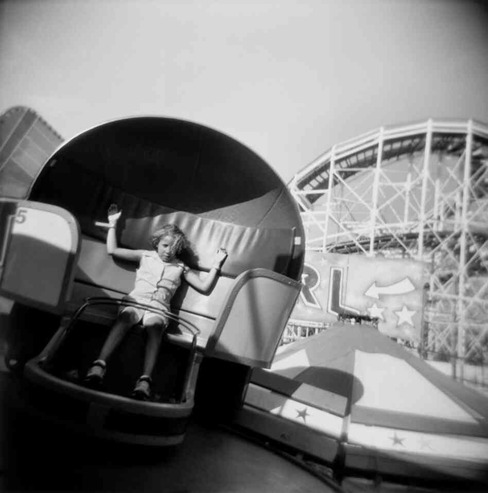 Girl on Tilt-a-Whirl, Coney Island, NY