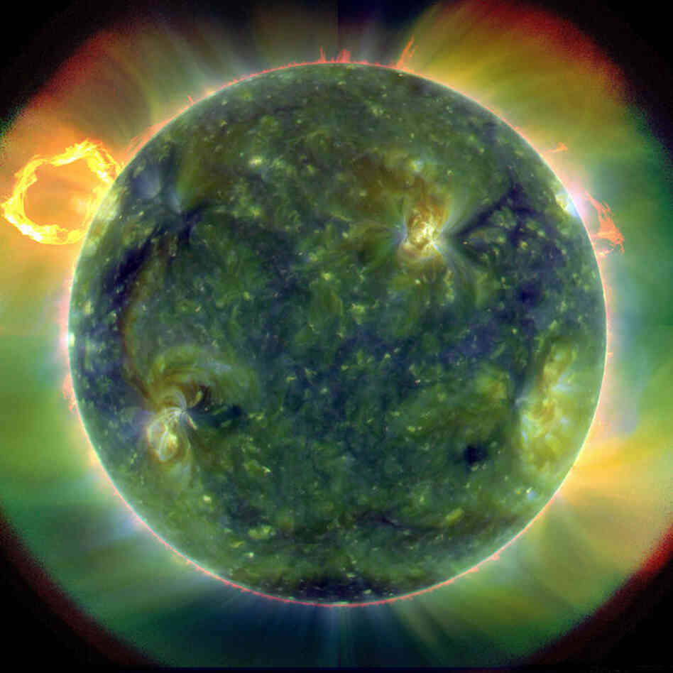 This ultraviolet image of the sun, with false color traces, indicates different gas temperatures. The blues and greens show the hottest, at nearly 1.8 million degrees Fahrenheit, while reds are around 107,000 degrees. The new telescope, currently orbiting the Earth, was designed to study the sun's magnetic field and its influence on Earth. 