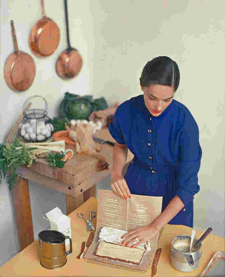 Woman preparing cake roll, photograph for the cover of McCall's Homemaking Magazine, circa 1938