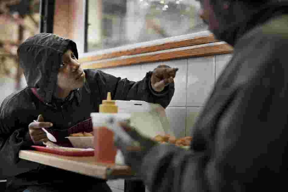 Lisa and Chuck eat a meal in a Chinese restaurant.
