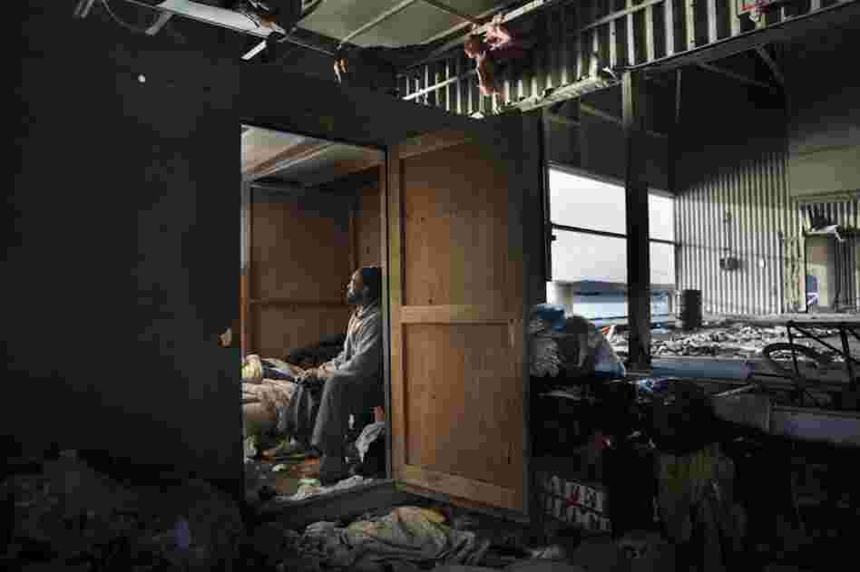Country sits in his home in a derelict sanitation facility he calls "The Whitehouse."