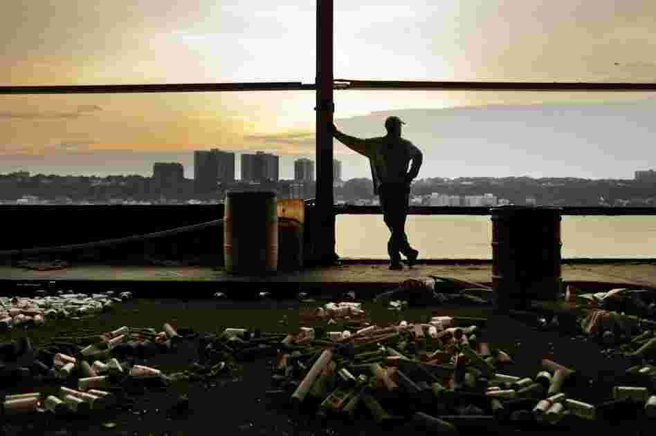 Country watches the river from his home in a building known as "The Whitehouse." Country is waiting for the return of a whale that he says has visited before.