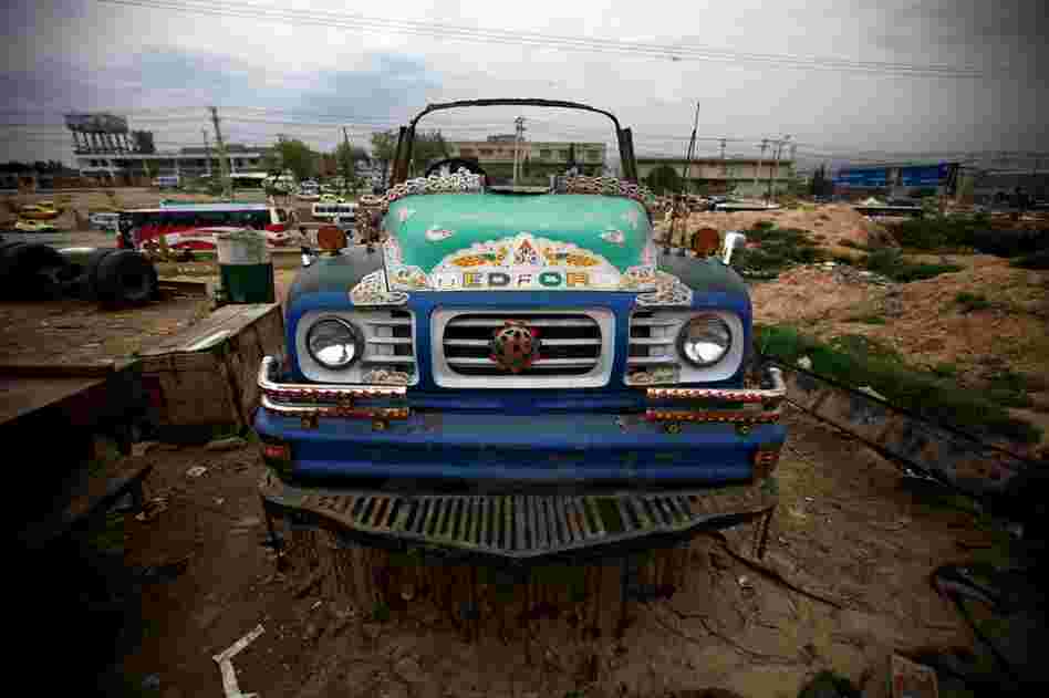 A mile away from the Grand Trunk Road on one of its offshoots, a truck cab is up on blocks.