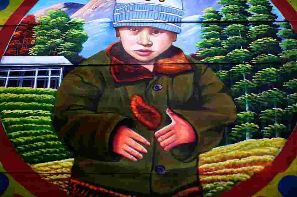 People make very specific requests for their truck art. Most want to express pride for their hometown region, but many also have more personal requests. Saeed recently completed a portrait of a truck driver's son — from a photograph the driver provided.