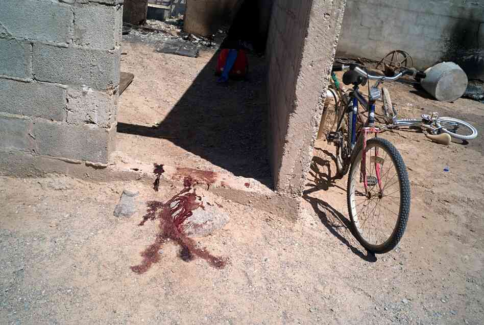 Blood stains from the site where a man was murdered in the border town of La Esperanza in Juarez Valley. 