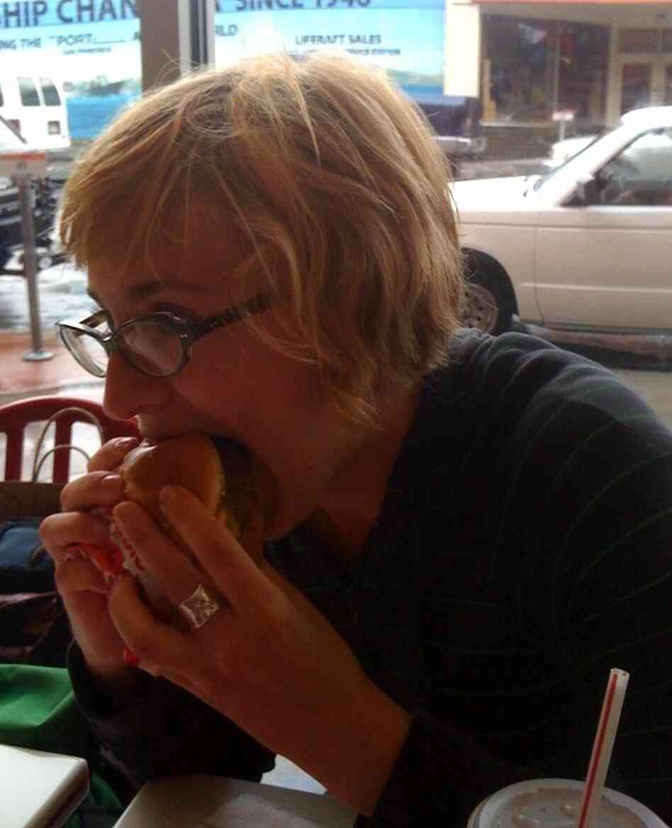 Eva tries the 4x4 burger. Eva tries the 4x4 burger.