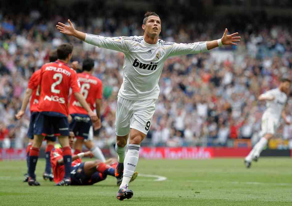 Cristiano Ronaldo of Real Madrid celebrates after scoring in a recent match. Aside from being a great Portuguese midfielder, he has also been romantically linked to actress and socialite Kim Kardashian. 