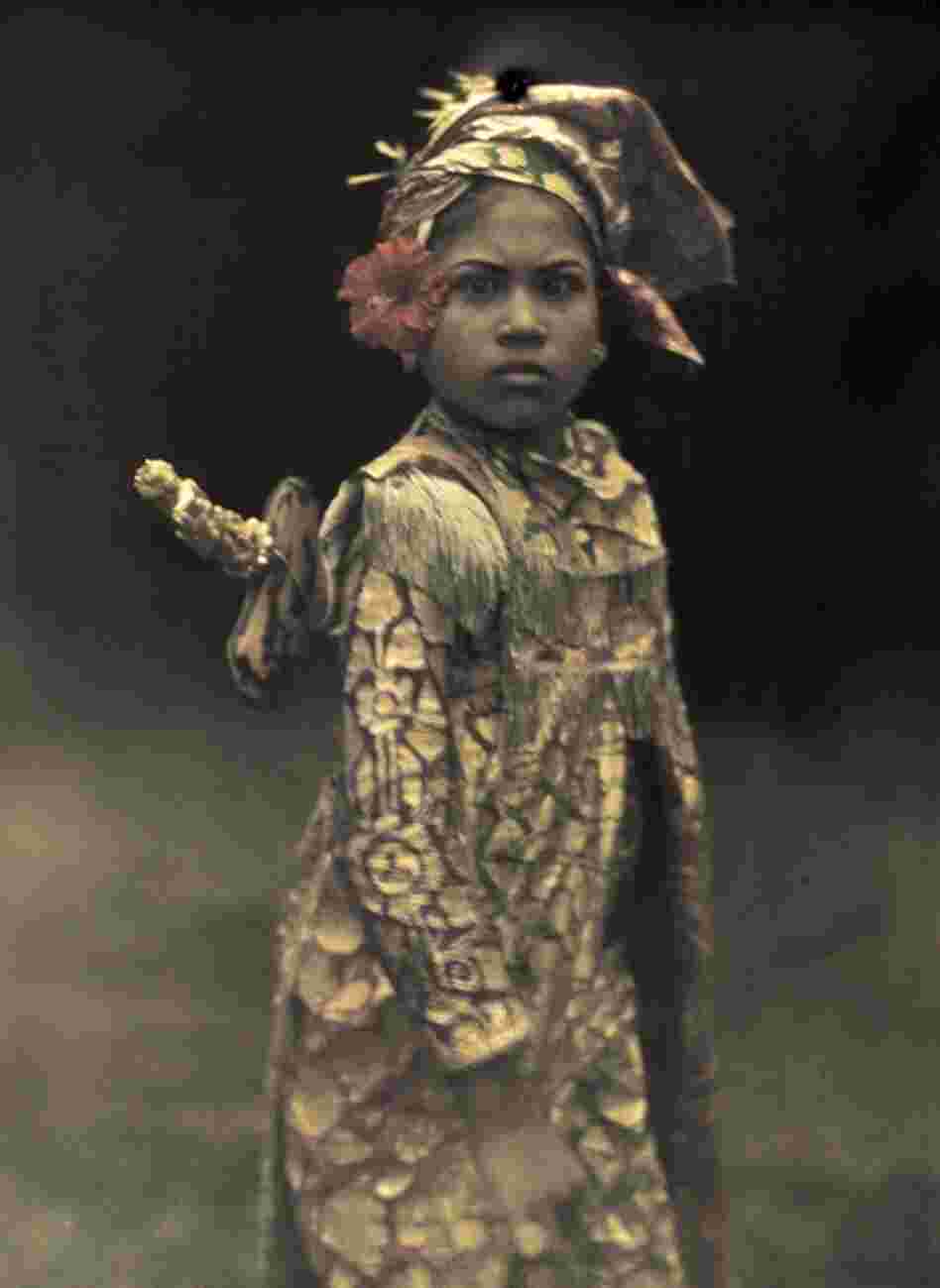 A popular child actress is costumed for the role of a mythological male warrior, Bali, 1928 