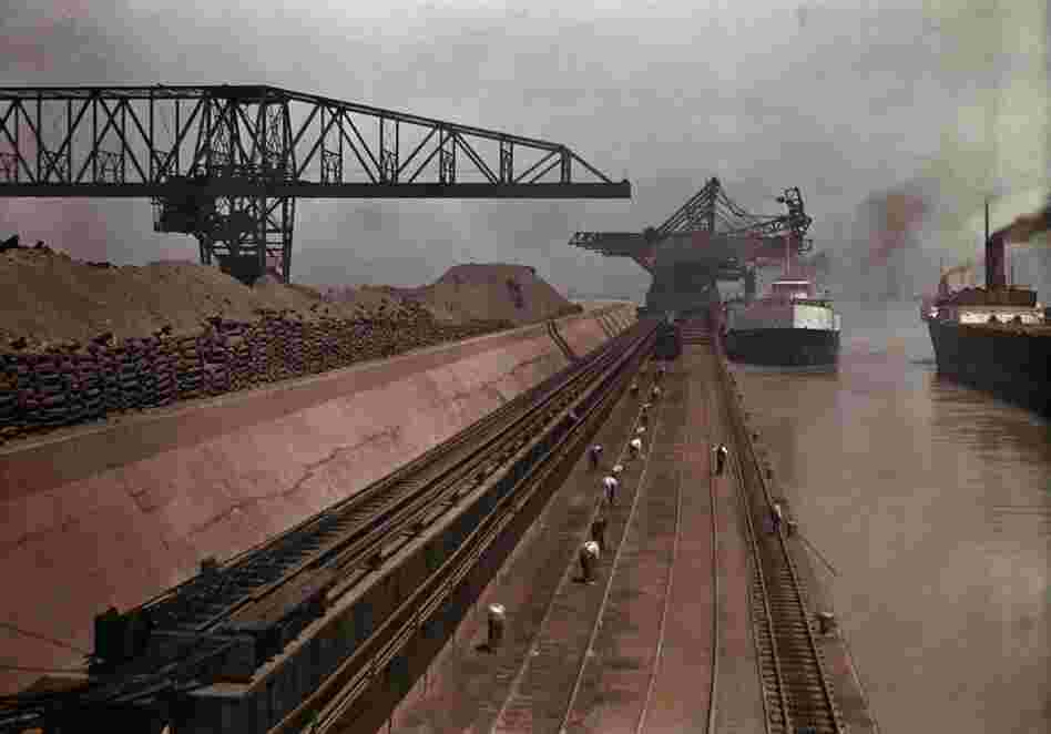 Ships approach a dock to unload iron ore in Ashtabula, Ohio, circa 1928 