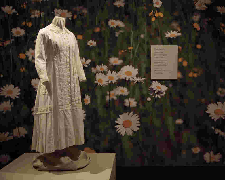 A reproduction of the white cotton dress Emily Dickinson wore while gardening, on display at the New York Botanical Garden. 