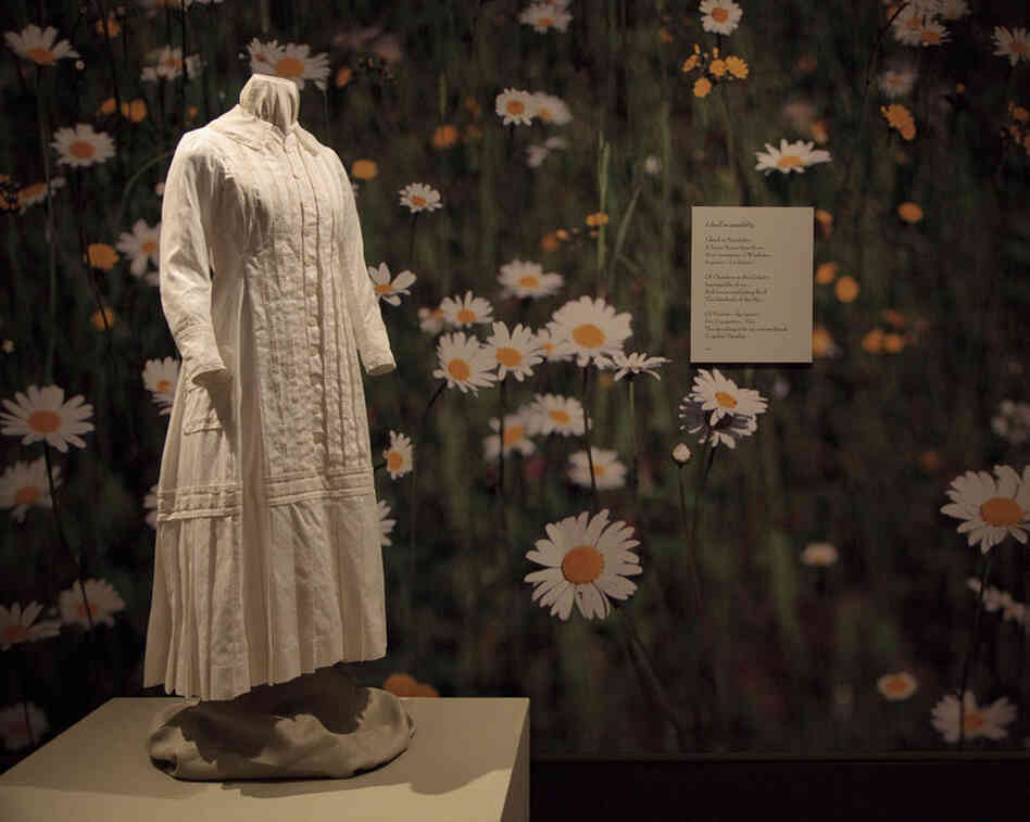 A reproduction of the white cotton dress Emily Dickinson wore while gardening, on display at the New York Botanical Garden. 