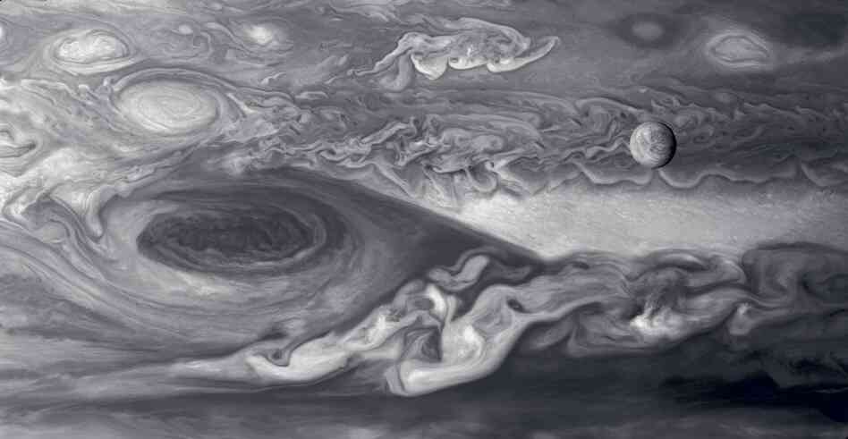 Europa And The Great Red SpotJupiter's moon Europa (upper right) is slightly smaller than Earth's moon. To the left is Jupiter's Great Red Spot, a vast cyclonic storm system about two times the size of Earth. Mosaic compiled of multiple images. Voyager 1, March 3, 1979.