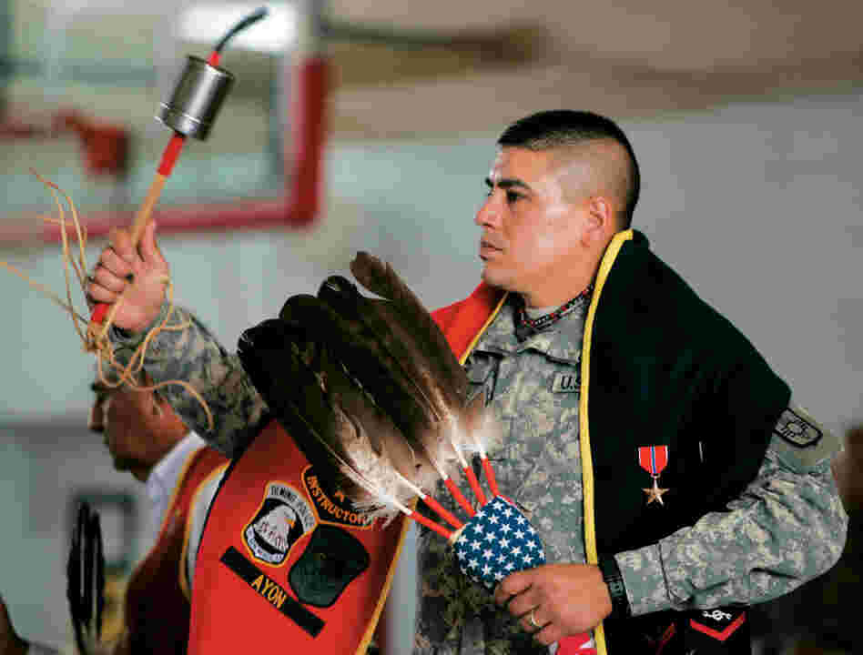 Lt. Bill Cody Ayon of the Tsitsistas, or Southern Cheyenne, participates in a Warrior Dance held at the National Guard Armory in Albuquerque, N.M. The Gourd dance blanket worn by Lt. Ayon is used to display military ribbons and awards. Ayon received a bronze star for running psychological operations in Iraq.