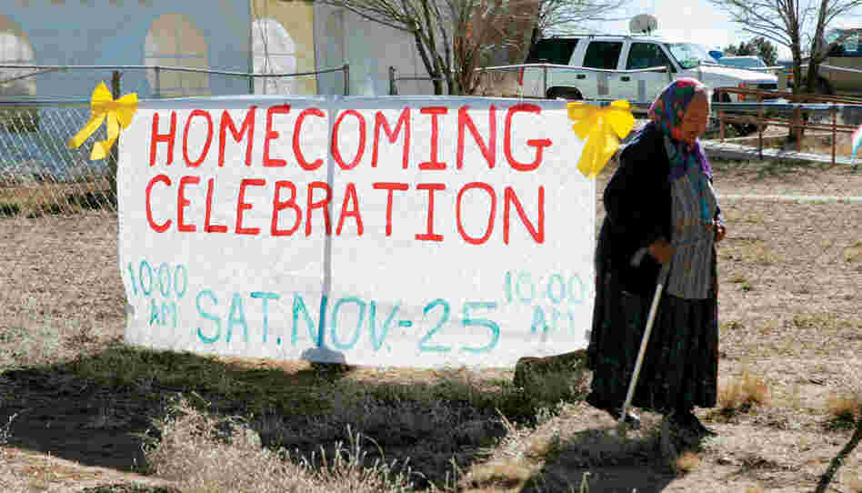 A woman walks to the Ramah Charter House to welcome home Navajo veterans of the Iraqi war.