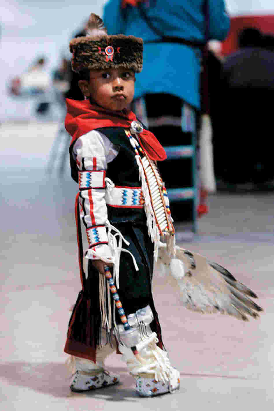 The Warrior Dance introduces young men to the warrior culture. Here, a boy in tribal costume dances in honor of Lt. Bill Cody Ayon.