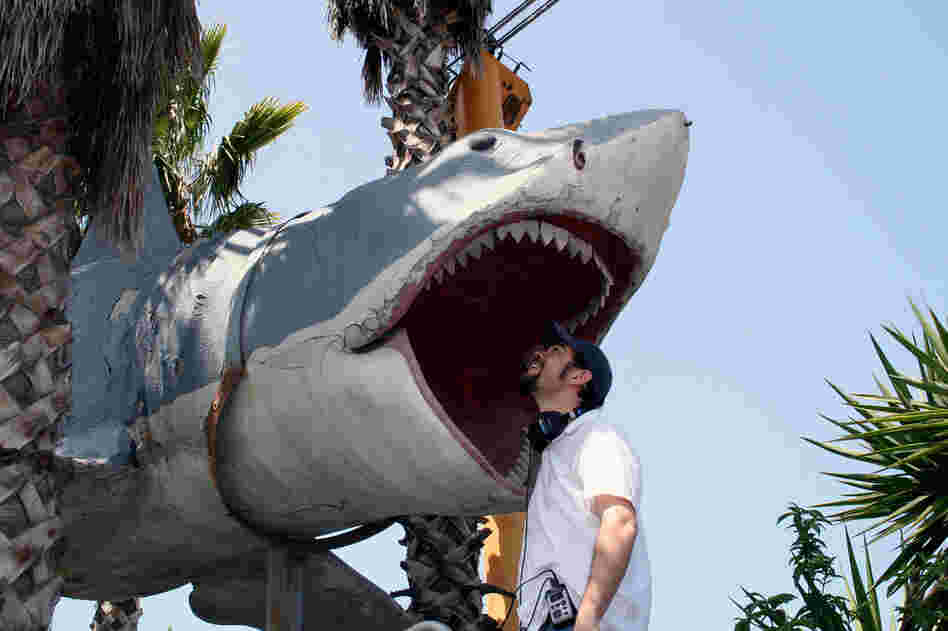 NPR reporter Cory Turner meets the fourth Bruce ... and finally gets to "touch the shark." This Bruce was not used in the movie but appears to have been cast from the now-lost Bruce mold. It hung on display at Universal Studios from 1975 until 1990 and now sits high above the U-Pick Parts yard owned and operated by Aadlen Bros. Auto Wrecking in Sun Valley, Calif. 