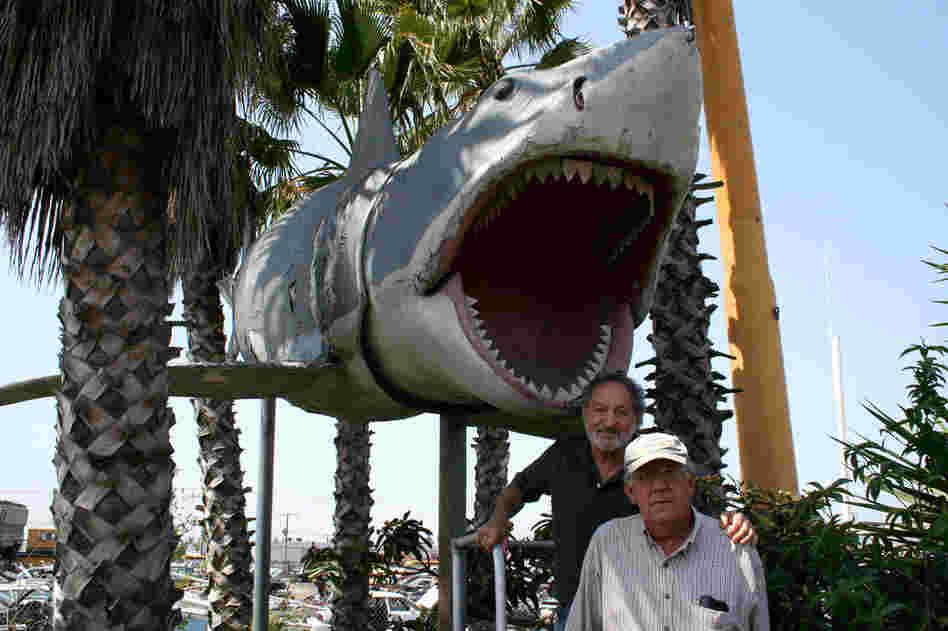 Art Director Alves (left) and Roy Arbogast, who helped build the original Bruces, with the fourth Bruce in Sun Valley. 